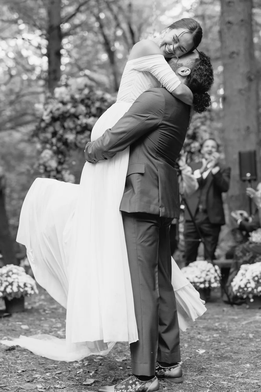 Groom picking up the bride